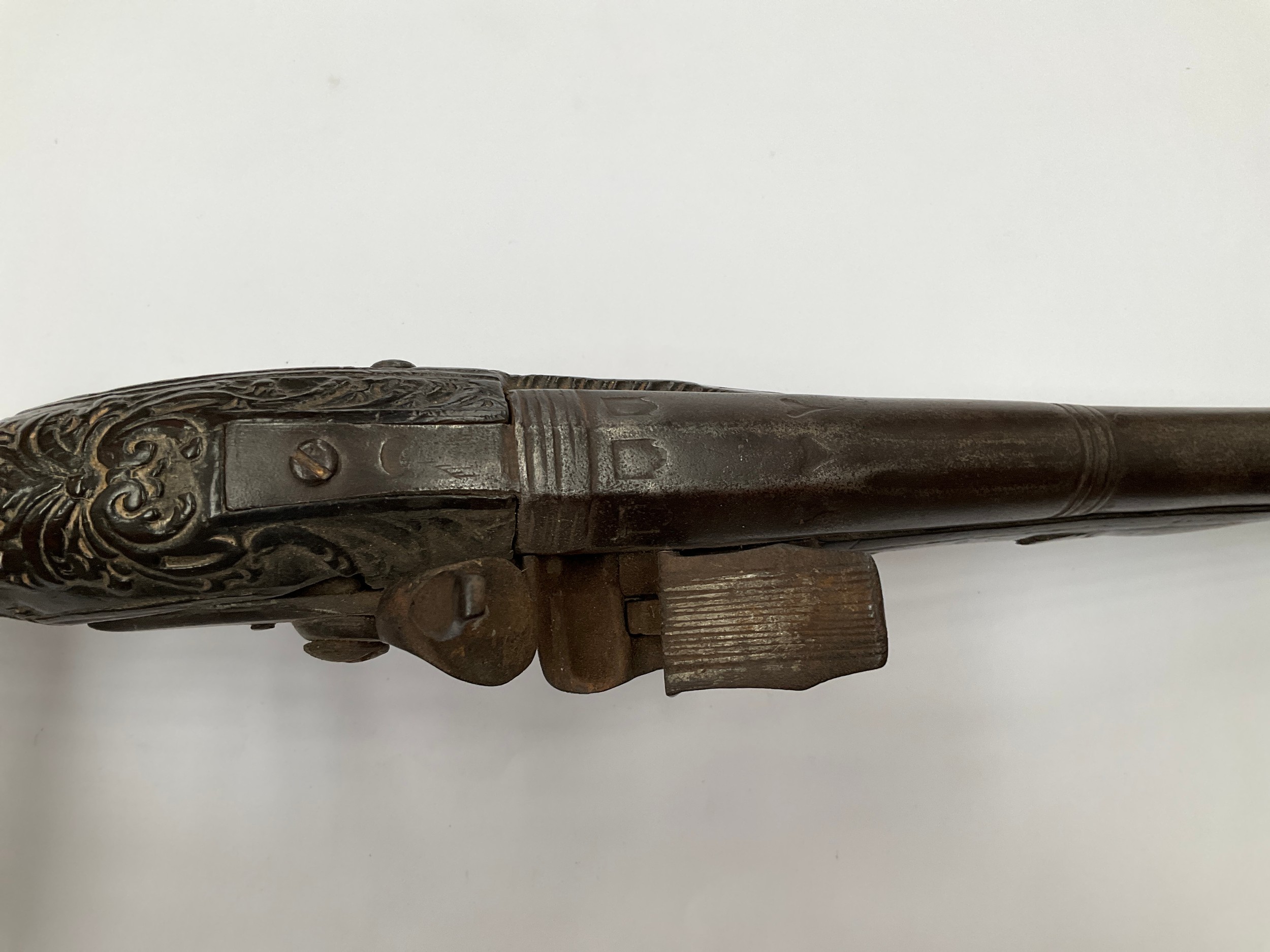 A late 18th Century flintlock pistol with all over scrolled foliate carving, part of mechanism - Image 4 of 6