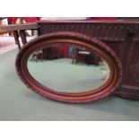 An oval ornate frame copperized wall hanging mirror, 55cm x 83cm total