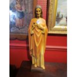 A resin figure of Jesus Christ, 61cm tall