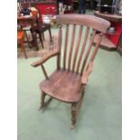 A Victorian elm seated and lathe back rocking chair