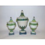 A trio of French faience glazed pottery lidded pots, fruiting foliate design, cockerel and F
