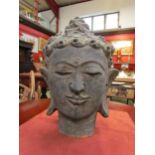 WITHDRAWN:An earthenware Buddhas head, 33cm high