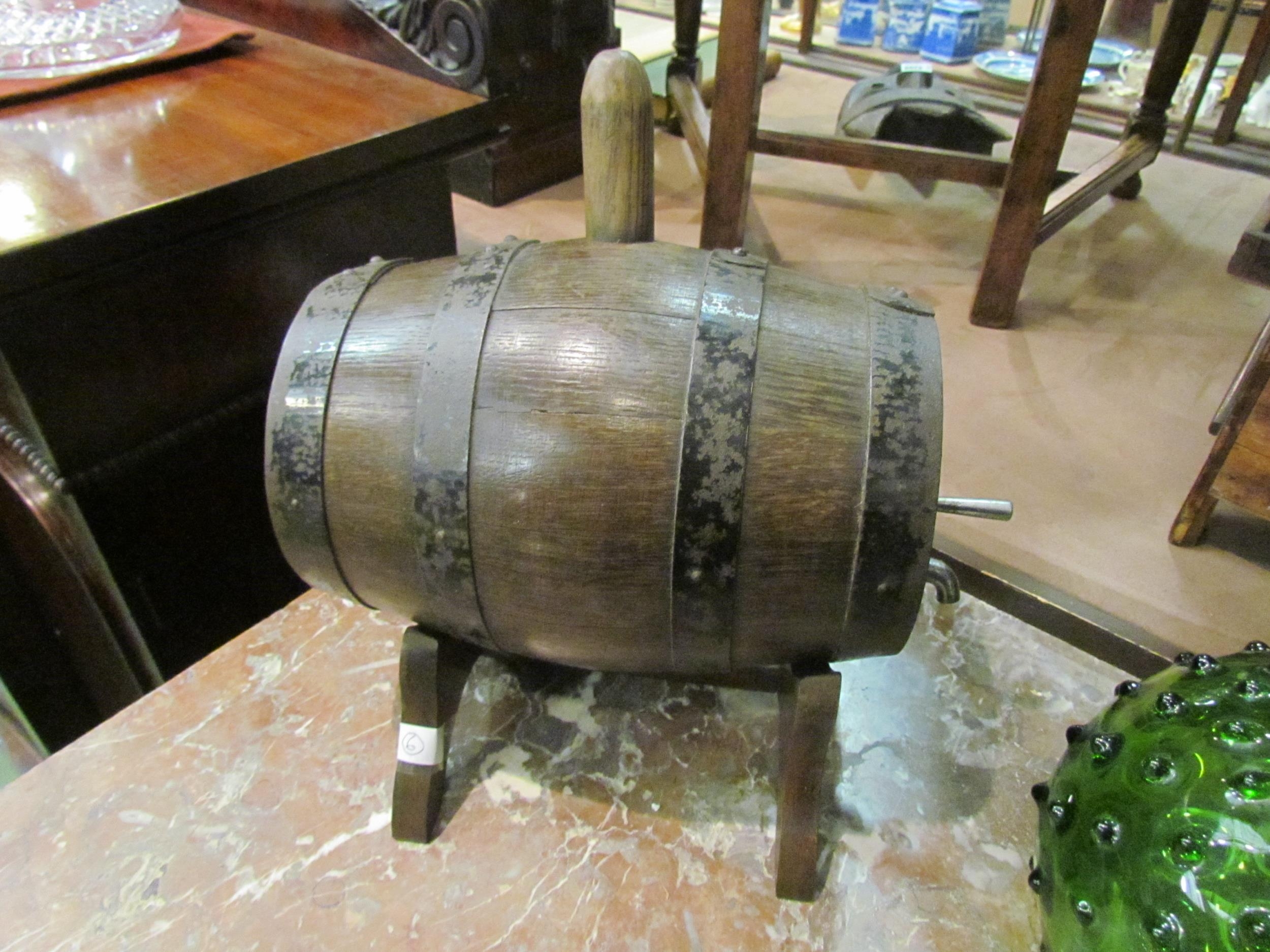 An oak keg/barrel with tap and stand