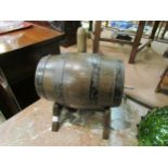 An oak keg/barrel with tap and stand