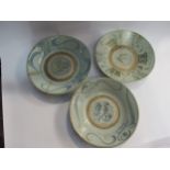Three Oriental blue and white plates, a/f 26cm diameter (3)