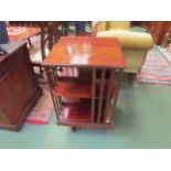 An Edwardian mahogany and satin walnut crossbanded revolving bookcase, 83cm high