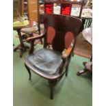 A late Victorian/early Edwardian mahogany office/desk chair with bottle green leather upholstered
