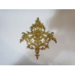 A late Victorian ornate ormolu furniture mount in the French taste, with a faun mask surmounted by a