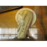 A plaster Art Deco wall plaque, side profile of a veiled lady, 32cm high