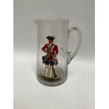 A Victorian clear glass water jug with hand-painted figure of "Battalion Soldier Coldstream Guards