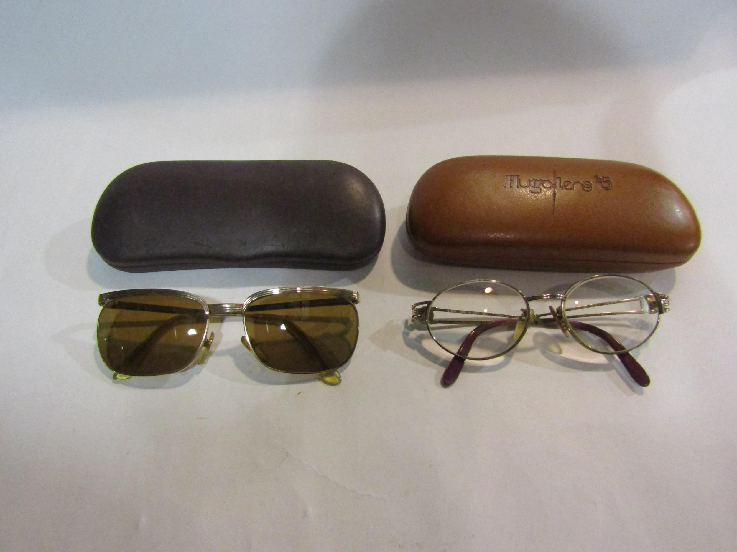 A pair of Fendi glasses and a pair of 12k plated sunglasses (2)