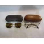 A pair of Fendi glasses and a pair of 12k plated sunglasses (2)