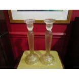 A pair of slender faceted form candlesticks, 31cm tall