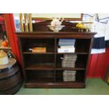 Circa 1900 an oak side by side bookshelf the raised back over six height adjustable shelves on a