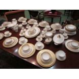 A collection of Royal Doulton "Royal Gold" and "Belmont" pattern dinner wares with similar pieces