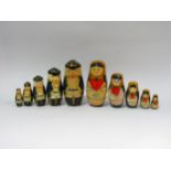 Two sets of Russian dolls, one female the other sailors