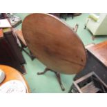 Circa 1780 a mahogany circular tilt top wine table on baluster turned column on pad foot tripod