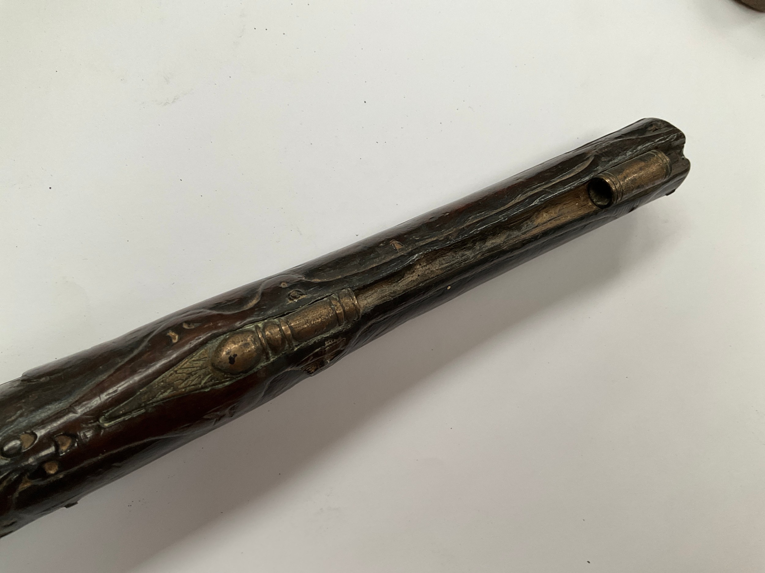 A late 18th Century flintlock pistol with all over scrolled foliate carving, part of mechanism - Image 6 of 6