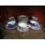 A collection of blue and white Willow pattern china including Wedgwood and Wood & Sons