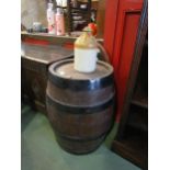 A Lacons coopered oak beer barrel a/f and a Morgans Norwich stoneware flagon