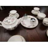 A Royal Worcester June Garland pattern tea set for six place settings, white ground with floral