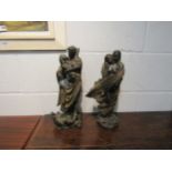 Two bronze effect figural groups of semi-clad couples embracing, 39cm and 36cm high