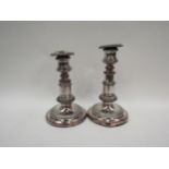 A pair of Sheffield plate on copper candlesticks, gadrooned detail, 16cm tall