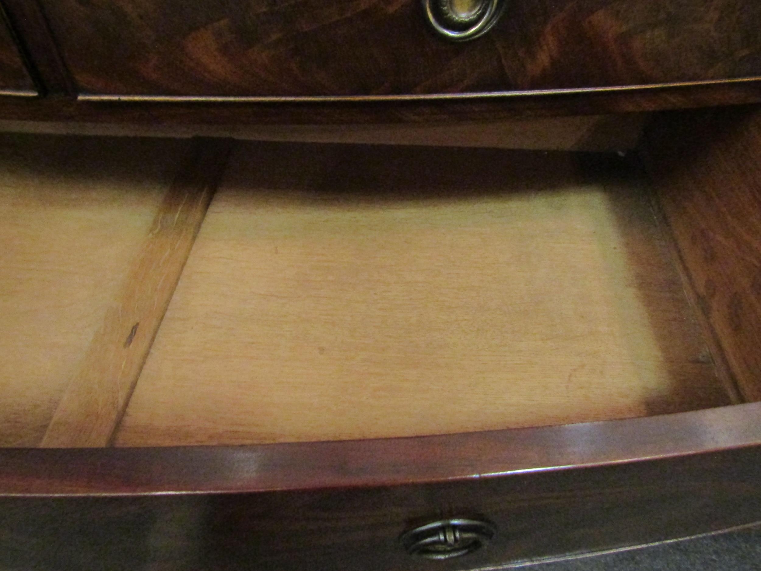 A George III flame mahogany bow front chest of two short over three graduating long drawers with oak - Image 3 of 4