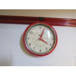 A "Retro Vintage" red metal framed wall clock, 23cm diameter