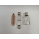 Three scent / perfume bottles: one a double-ended example by Sampson Mordan & Co. with metal ends,