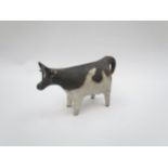 A Tessa Fuchs studio pottery figure of a cow, 8.5cm high, tail a/f