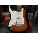 A Fender Squier Affinity series ‘Strat’ Stratocaster style electric guitar with sunburst body,