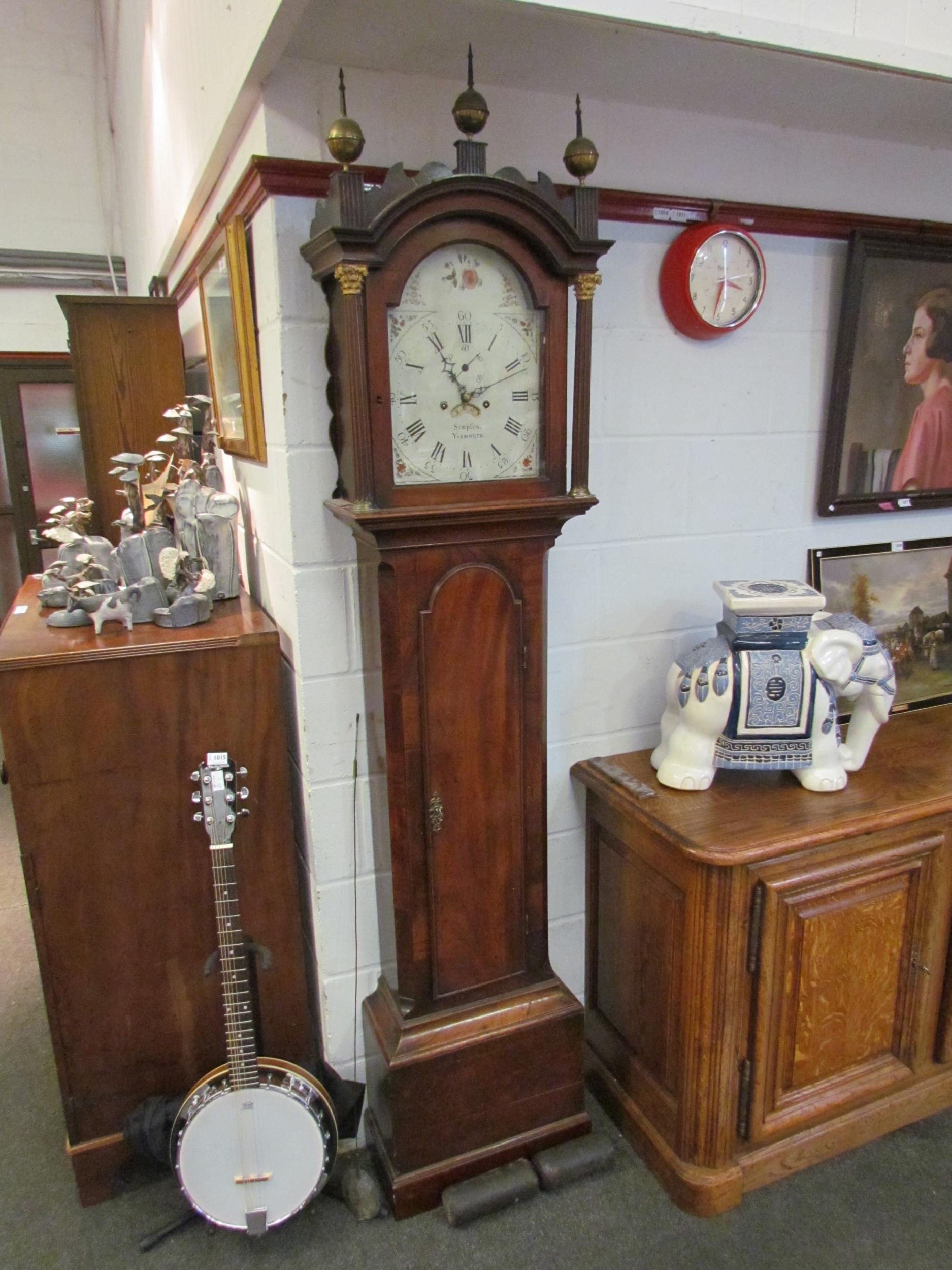 A late 18th Century mahogany longcase clock, the painted face named "Simpson, Yarmouth", with key,