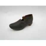 A 19th Century child's clog for shop display