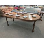 An oak extending dining table, 75cm high x 200cm long x 105cm wide extended