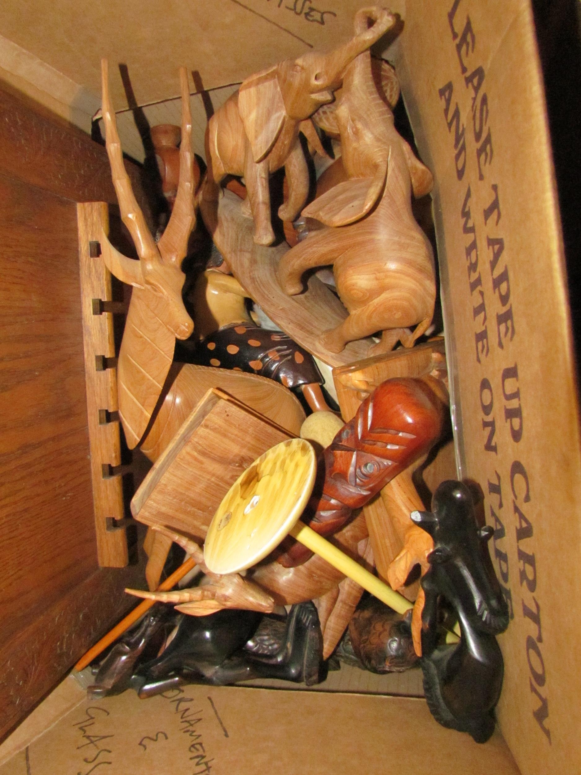 Two boxes of mixed items, treen, lamp, stone bed warmers, carved wooden animals etc - Image 2 of 2