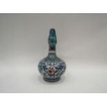 A Turkish Iznik style pottery jug/ewer with floral and foliate hand painted borders in blue tones,