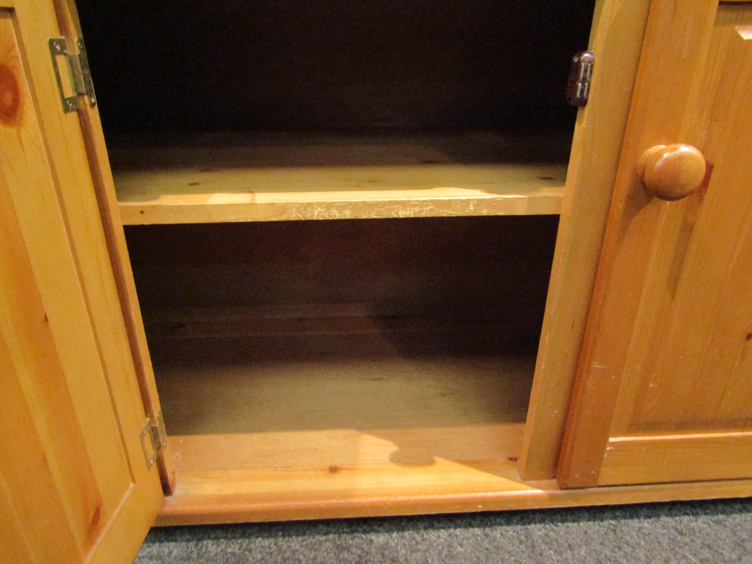 A modern pine dresser, the plate rack top over three drawers and three cupboards, 183cm high x 136cm - Image 3 of 4