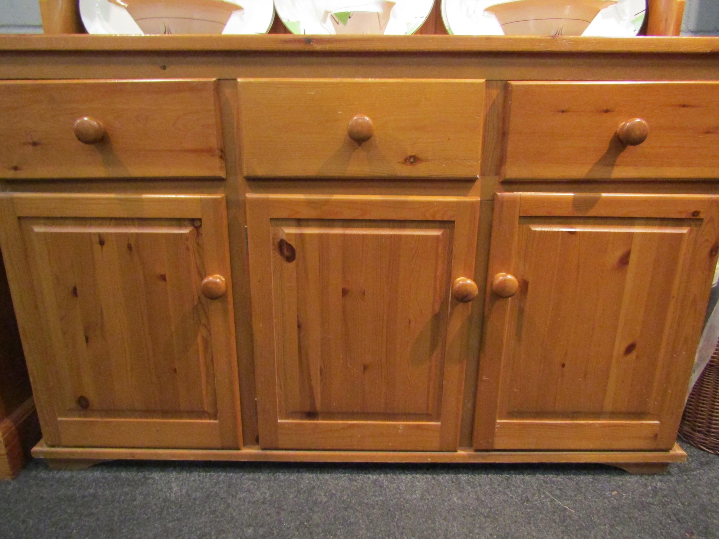 A modern pine dresser, the plate rack top over three drawers and three cupboards, 183cm high x 136cm - Image 2 of 4