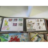 A collection of tea, cigarette and bubblegum cards and an album of first day covers