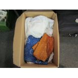 A box of assorted linen, a Civil Defence jacket, christening gown and pillow, a section of blue