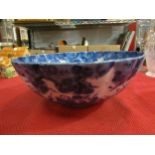 A Chinese scalloped edge blue and white bowl with figures and prunus, 25cm diameter