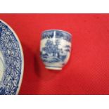 A Chinese blue and white bowl with mythical creature to centre and foliate border, hairline cracks