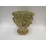 A composition garden urn with lion mask and ring loop detail to body, with Cotswold Studios Ltd.