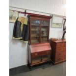 A Victorian bureau bookcase, lower cabinets having parquet base and bevel edged glass doors, upper