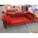 A William IV mahogany sofa, the deep button scroll back rest and scroll arms with carved fascia on