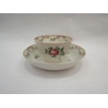 A late 18th Century New Hall porcelain tea bowl and saucer, floral sprays