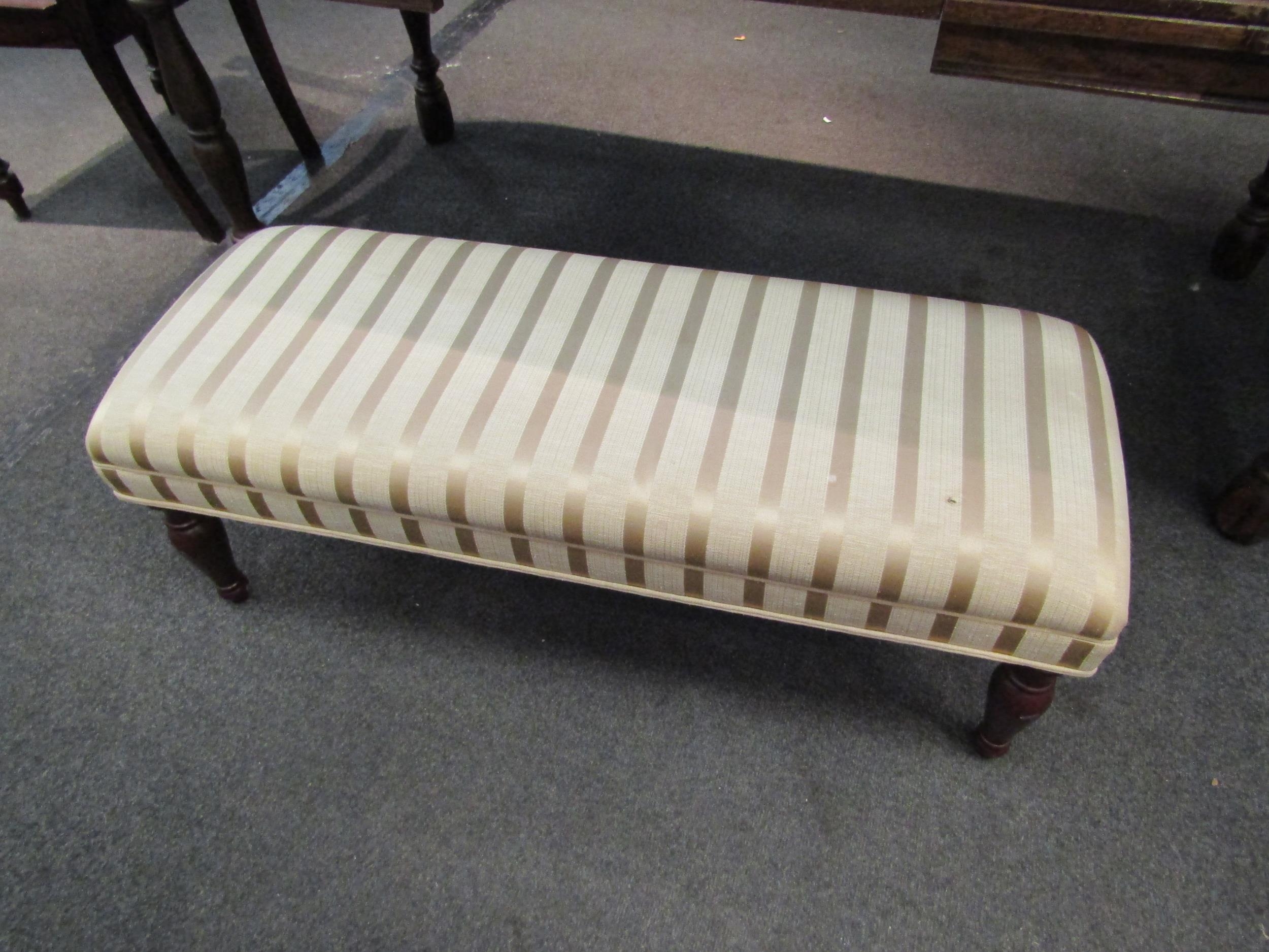 A Victorian style long footstool with Regency stripe upholstery, 36cm high x 106cm long