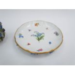 A 19th Century Meissen chocolate cup and cover decorated with high relief flowers and painted