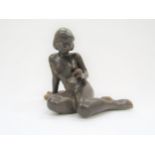 A Michael Anderson Bornholm pottery figure of a young girl, No.5979, treacle glazed, 17cm high